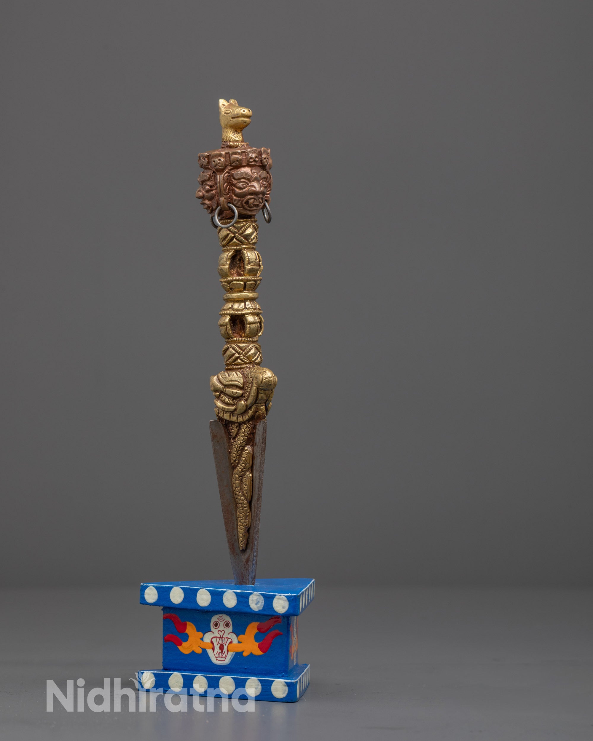 Full view of Tibetan Buddhist ritual Phurba, symbolizing transformation and obstacle destruction

