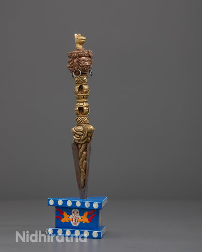 Full view of Tibetan Buddhist ritual Phurba, symbolizing transformation and obstacle destruction

