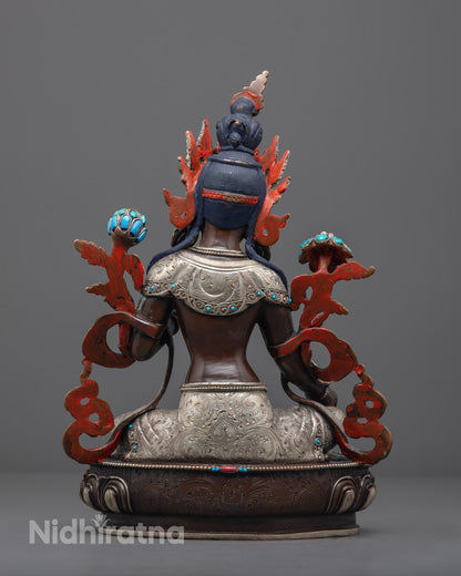 oxidized Green Tara statue in lotus posture, crafted using the lost wax method by Nepalese artisans.