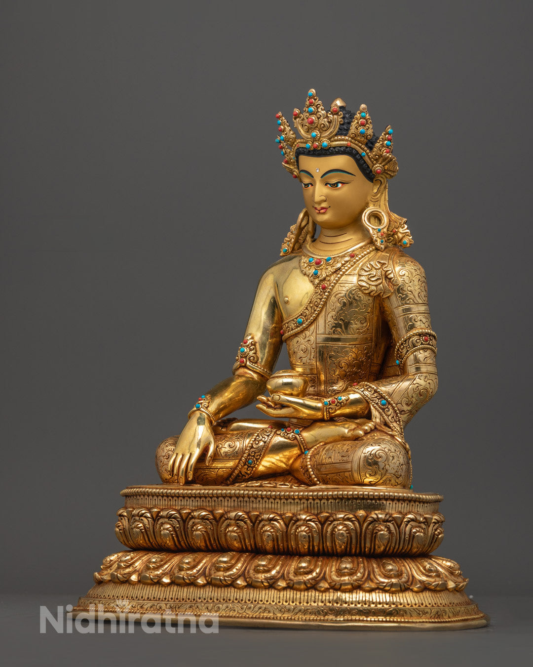 Crowned Shakyamuni Buddha Statue with vibrant detailing, lotus base, and spiritual symbolism, ideal for altars or meditation spaces.