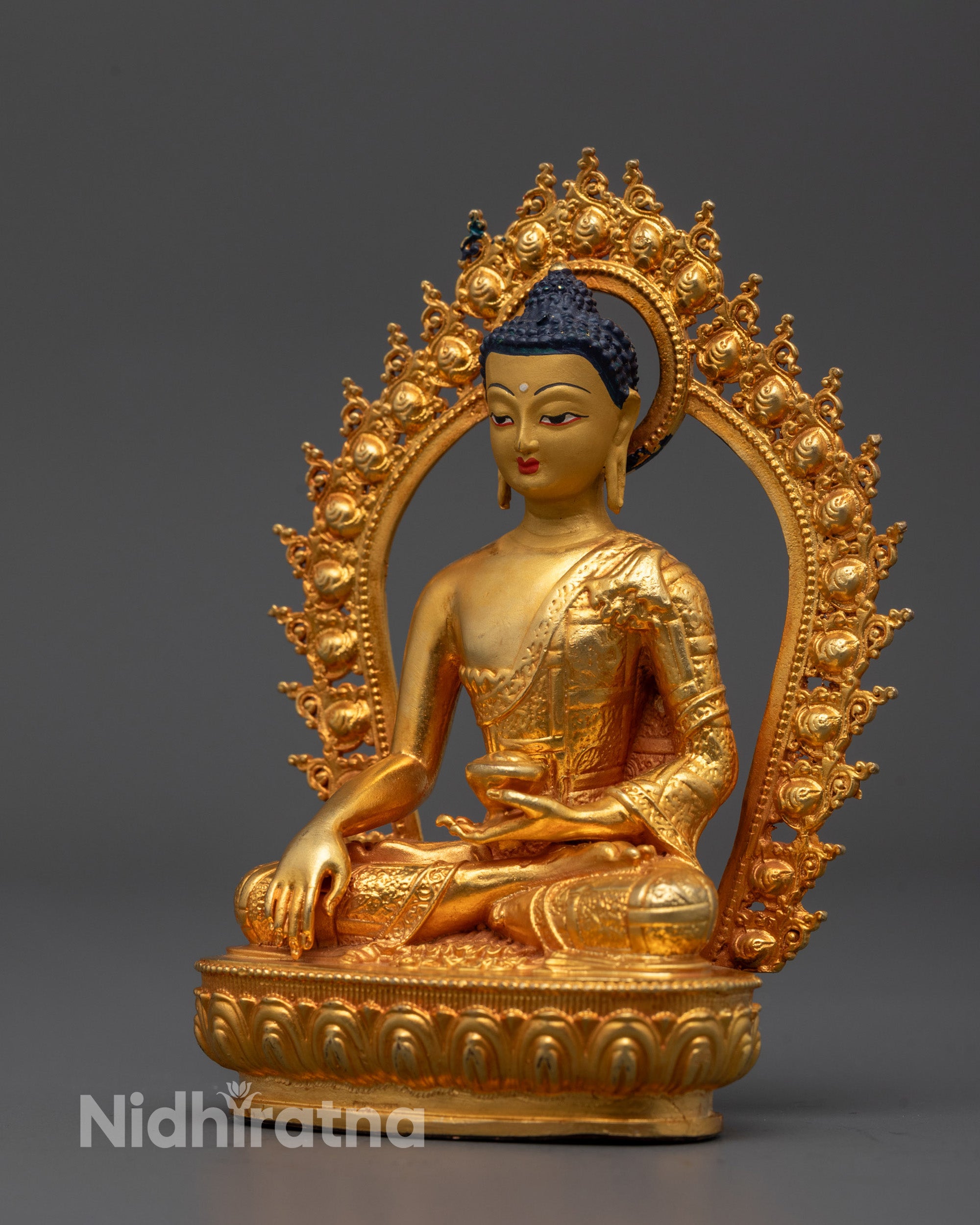 Full view of traditional Shakyamuni Buddha Statue with monk’s bowl in hand
