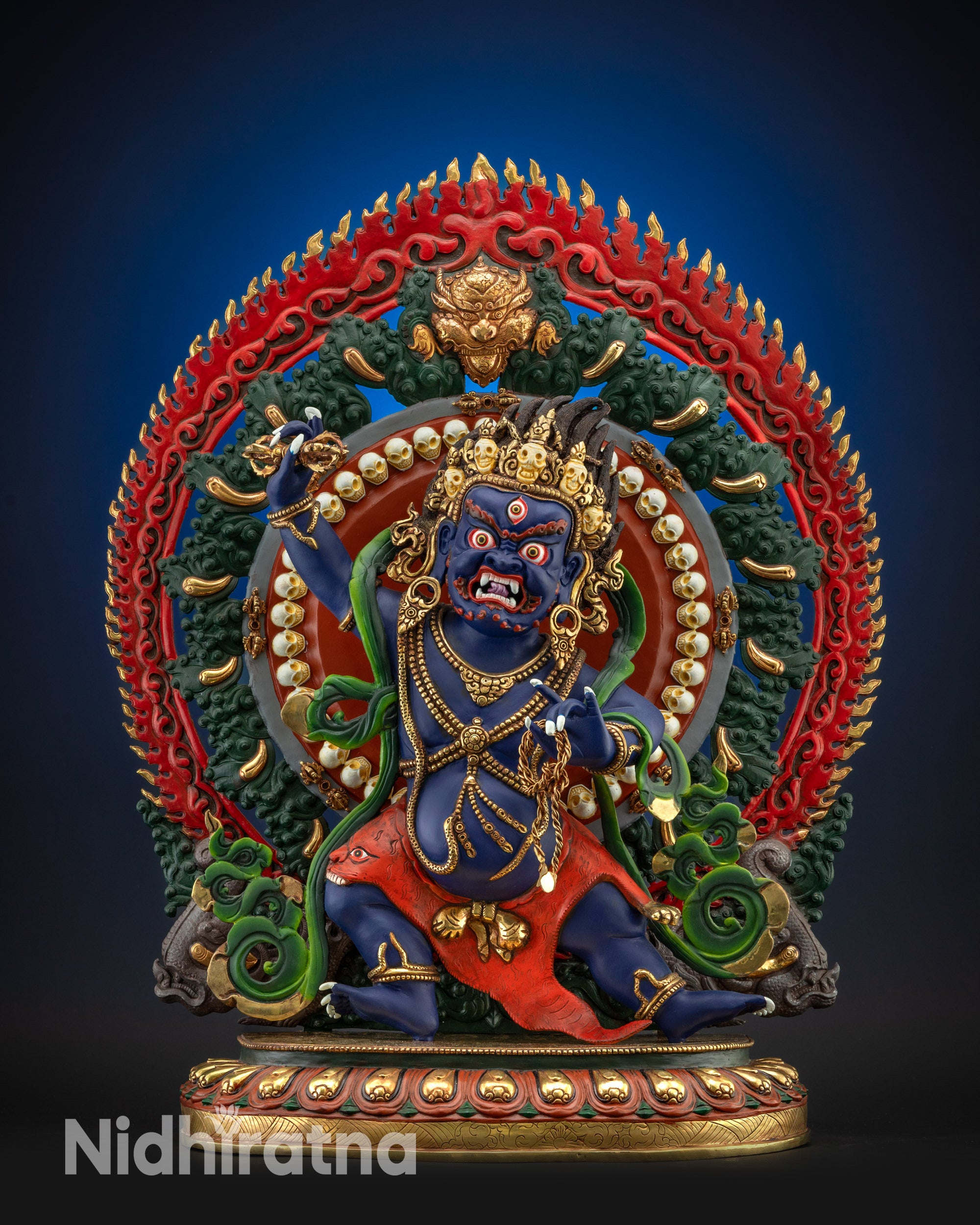 Full view of vibrant Vajrapani statue standing on ornate lotus seat and halo
