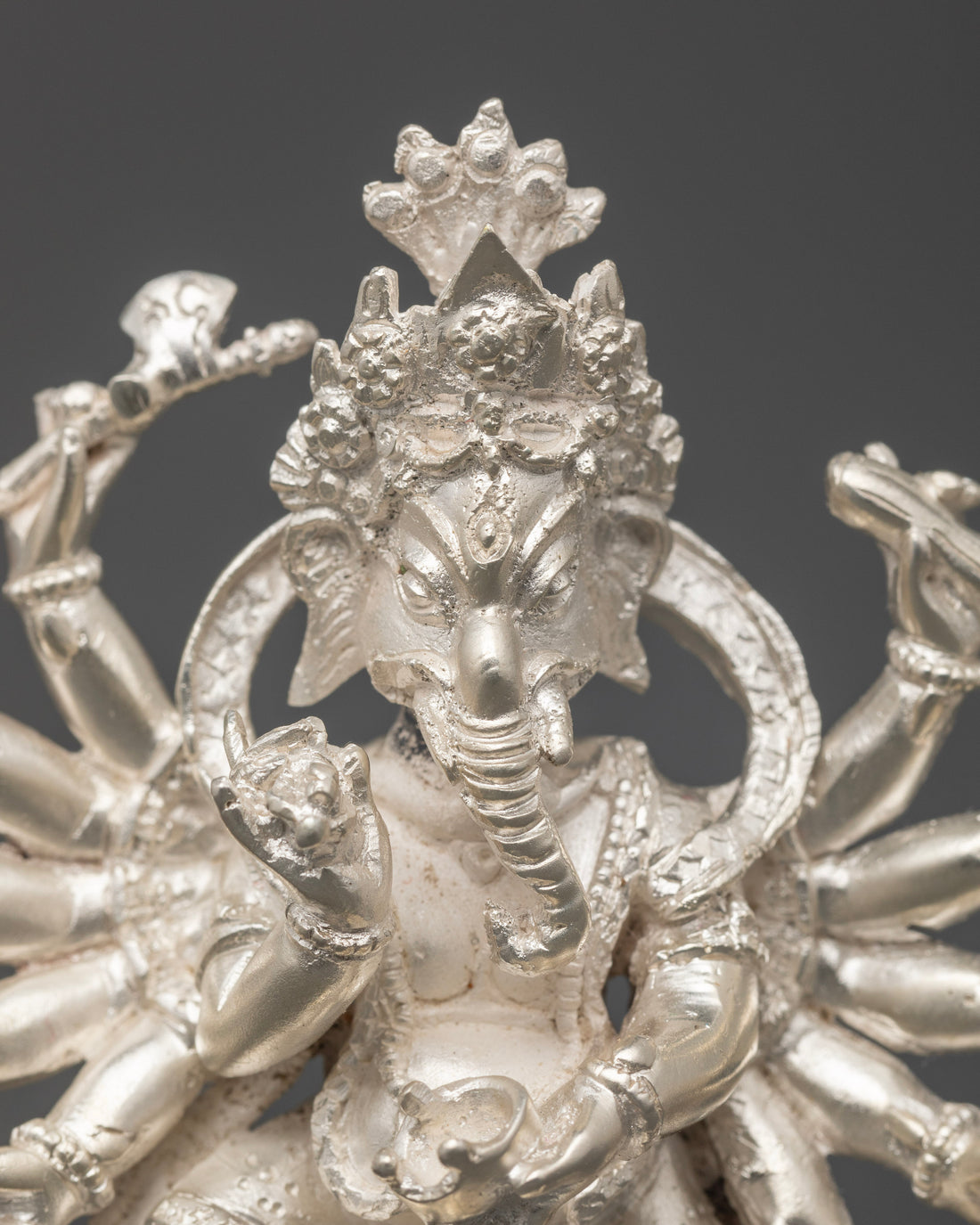 The Multi-Armed Ganesh: Embodying Infinite Wisdom and Grace