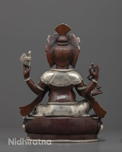 back view of silver-plated garments and lotus base of traditional ganesha deity sculpture