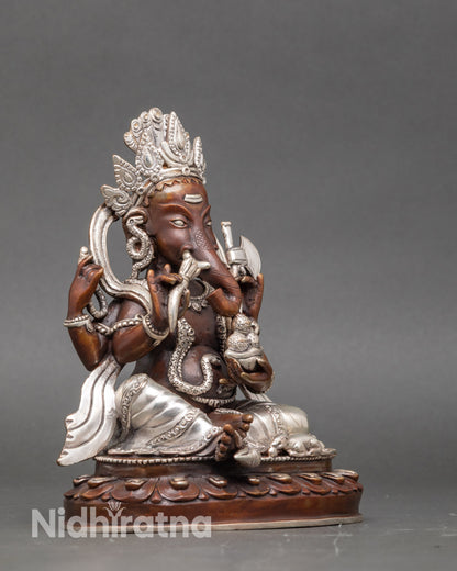 Ganesh idol with four arms, goad, noose, abhaya mudra, and modaka for spiritual practice