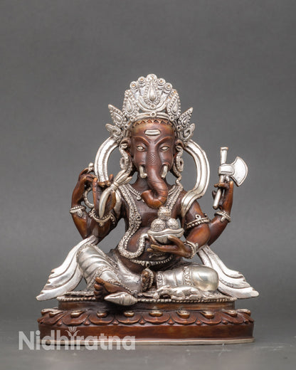 Ganesh meditation figurine handcrafted by Newari artisan, silver-plated Nepalese craft