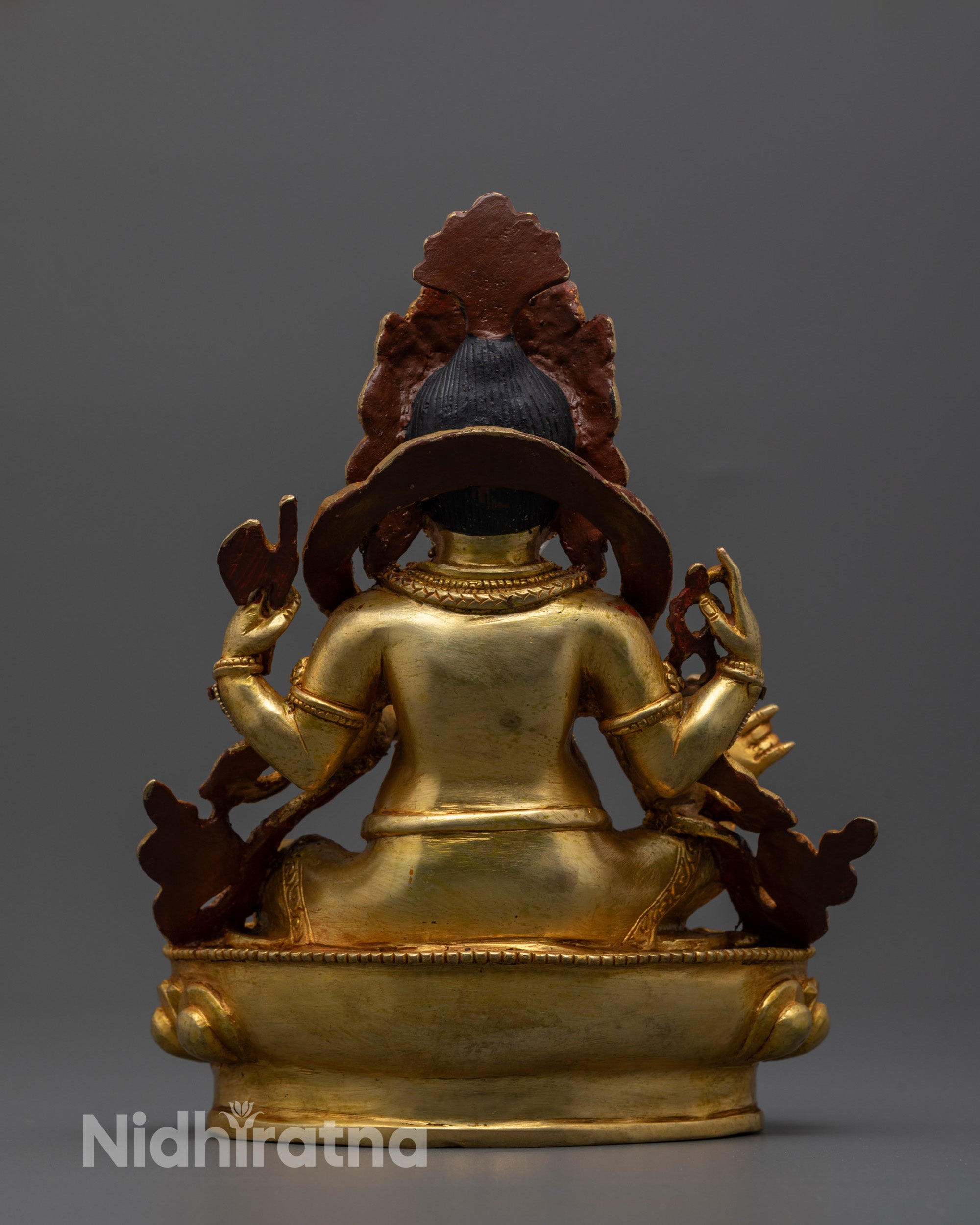 Back view of intricately carved 24k gold-plated Ganesh statue with sacred details