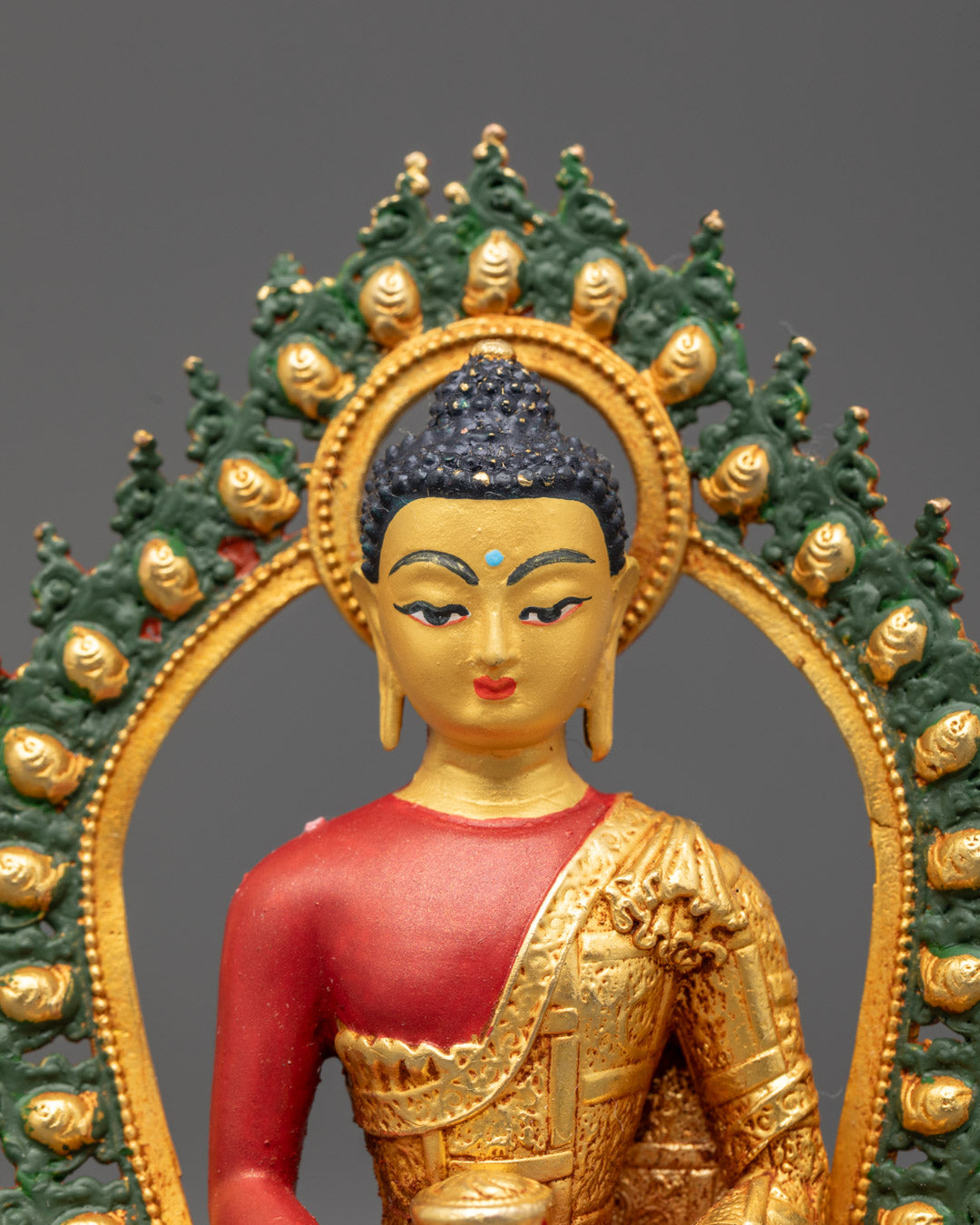 Gold-faced Amitabha Buddha holding monk's bowl seated on a multi-colored lotus throne
