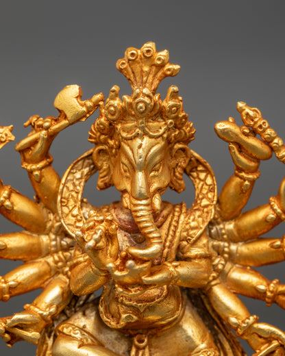 Gold-gilded Lord Ganesh figurine with 12 arms symbolizing wisdom and obstacle removal