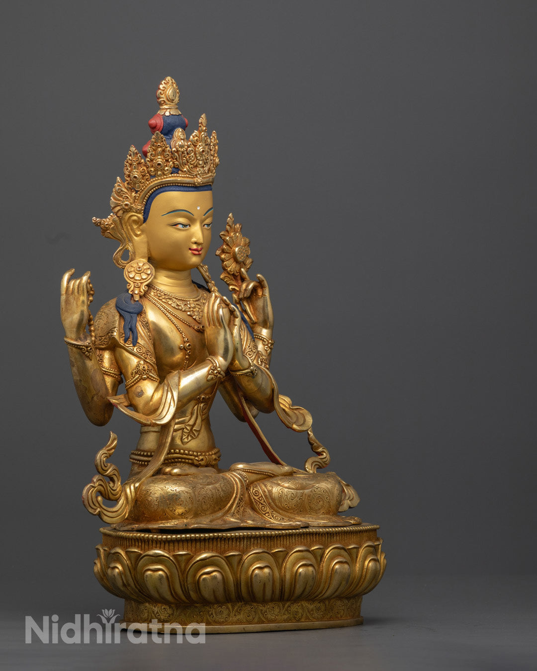 Gold-gilded face of Handmade Chenrezig Statue, representing enlightenment and divine compassion, perfect for meditation and spiritual decor.