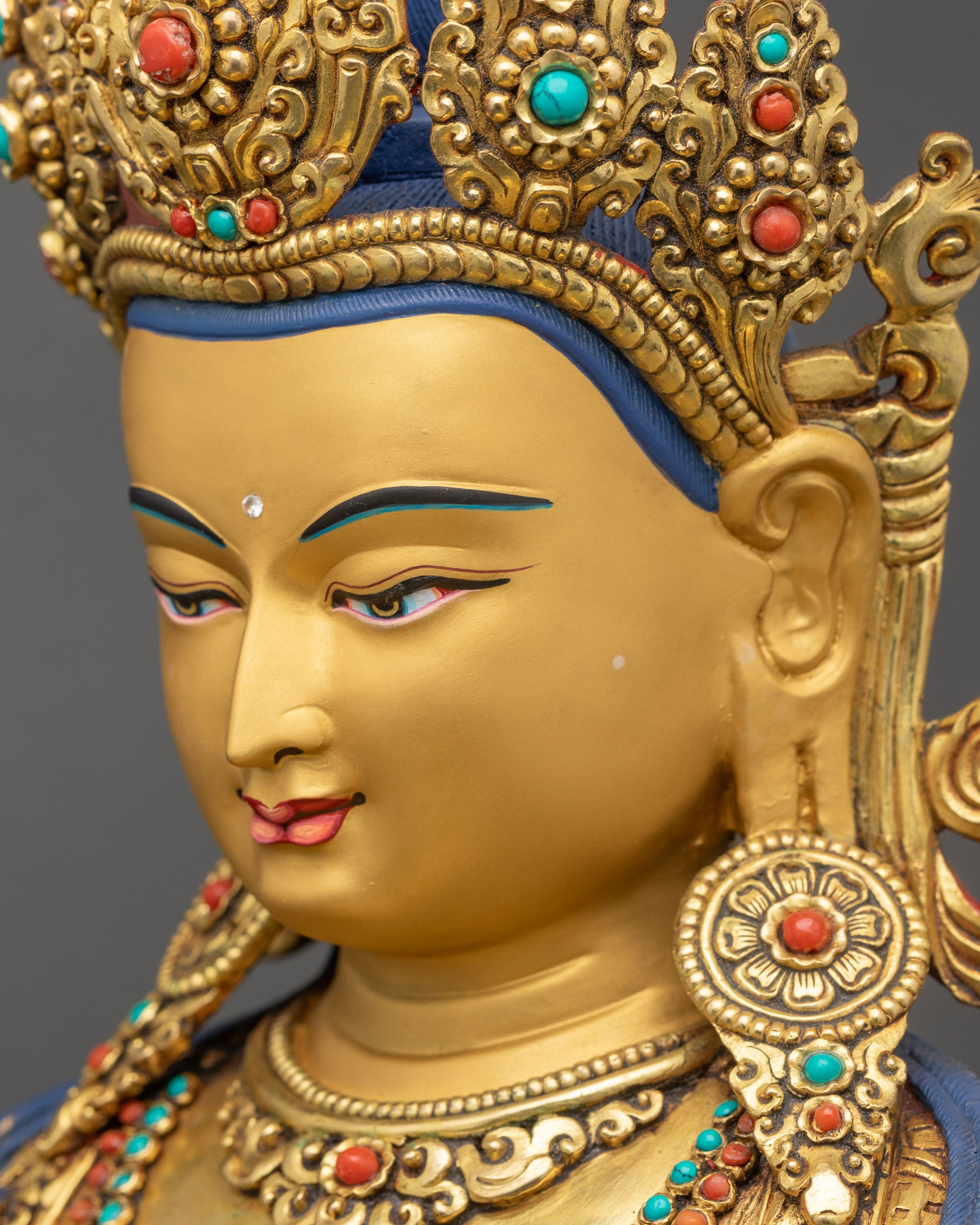 Gold gilded Vajrasattva side view with vajra and bell in lotus seat