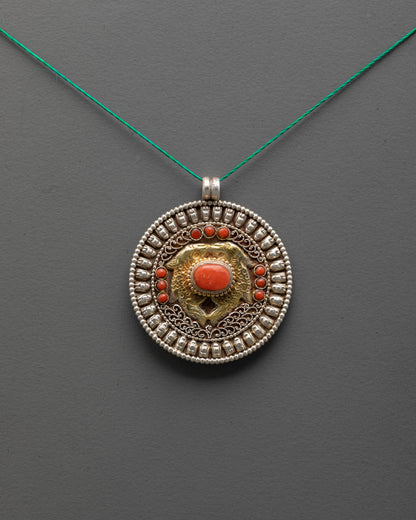 Golden Fish Locket front view with gold-gilded fish and coral stones

