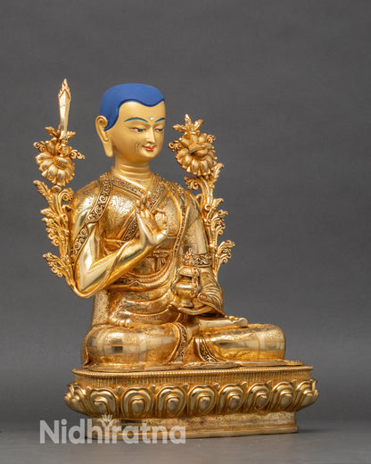 Golden fire-gilded Je Tsongkhapa statue highlighting serene facial expression