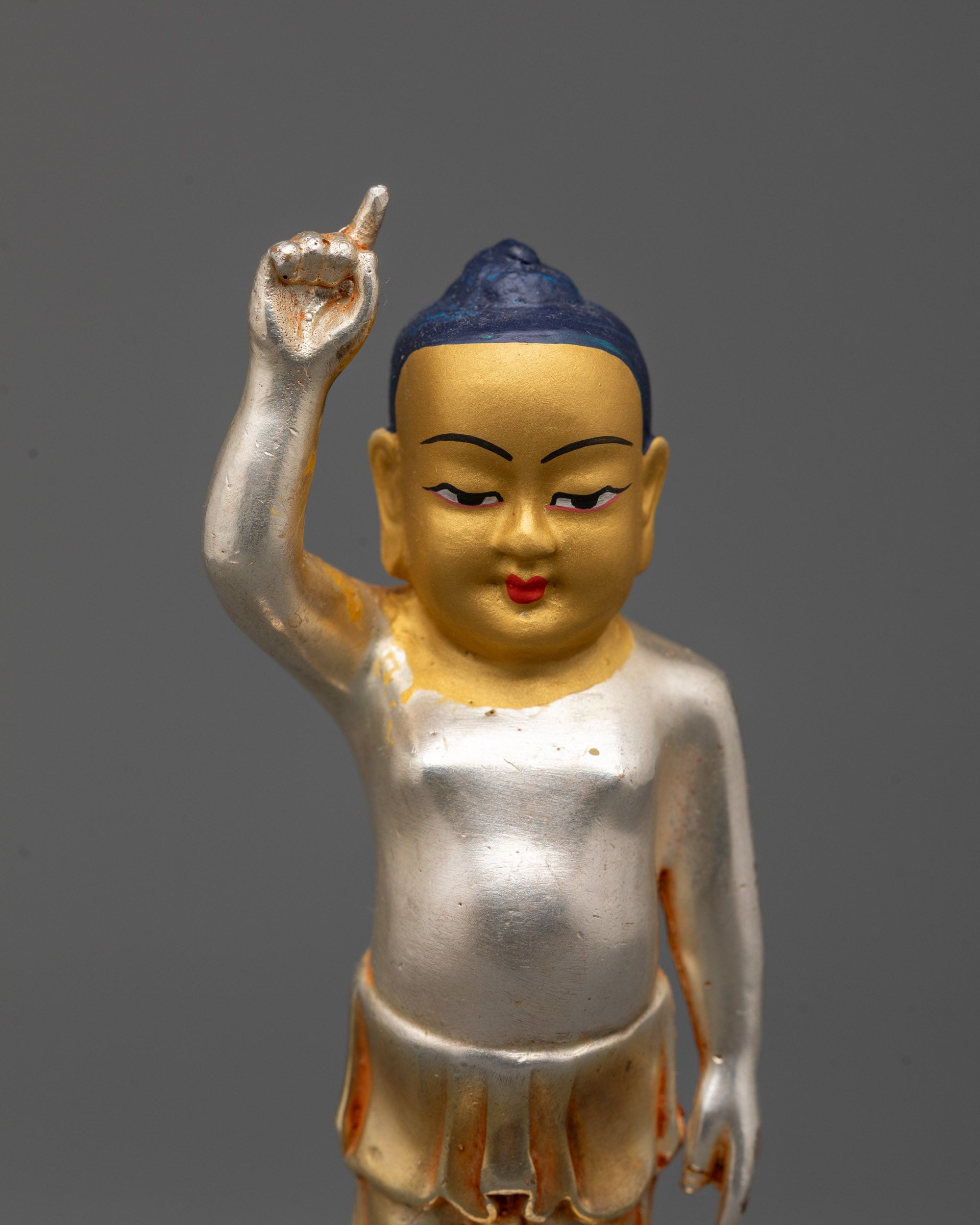 Gracefully crafted Little Buddha figurine with lotus base and radiant gold face