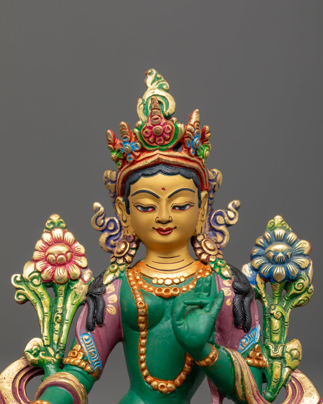 Green-Shade Mother Tara statue showing detailed carving on flowing robe and jewelry with uptala flower