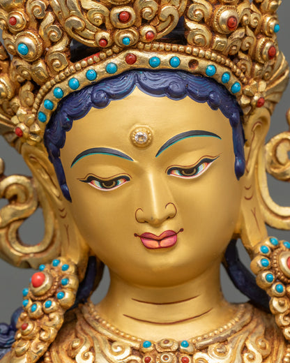 Green Tara Bodhisattva, serene gold-painted face, turquoise and coral