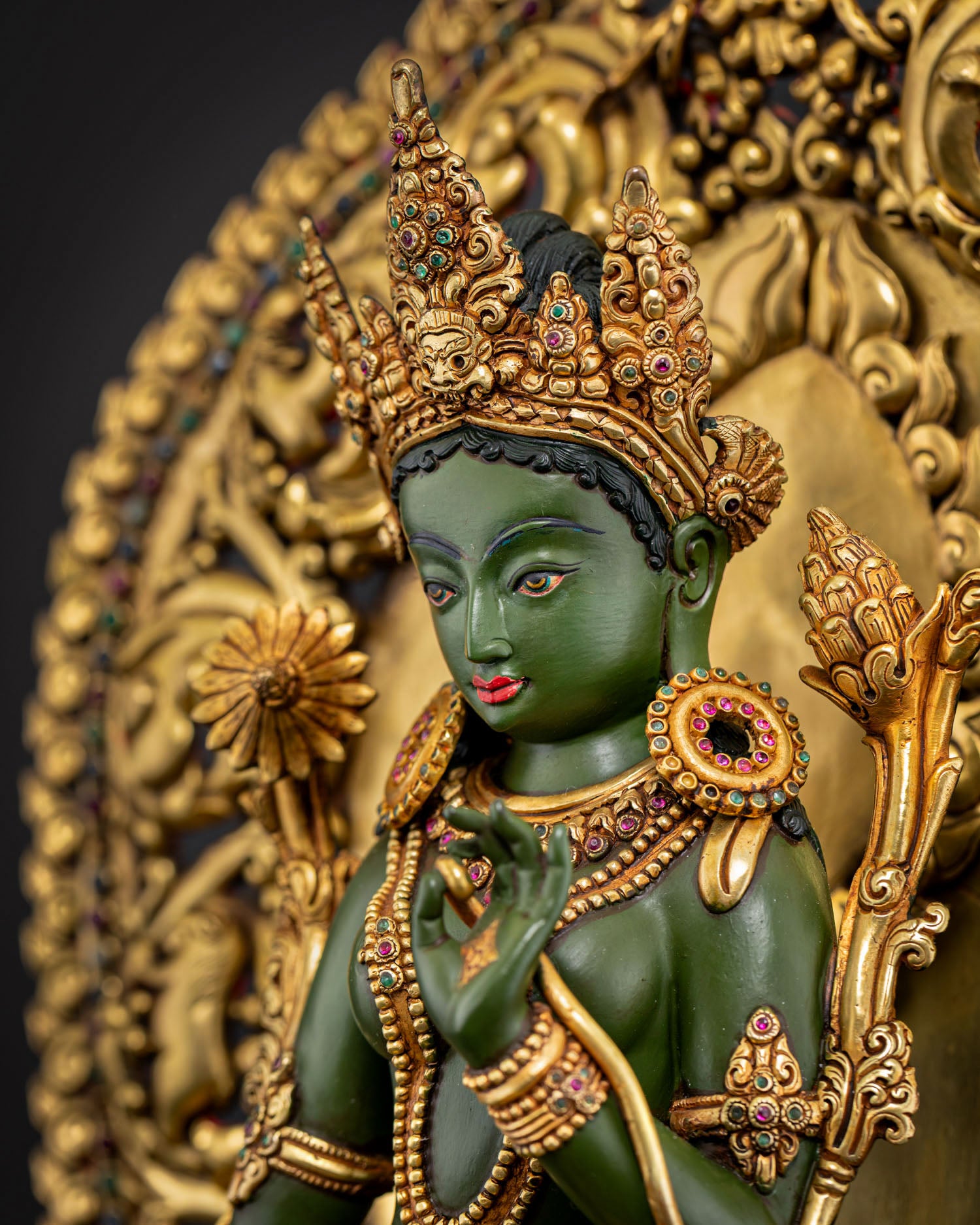 Green Tara side face close up jeweled crown Buddhist statue