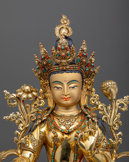 Close-up of Green Tara statue face and crown with 24K gold gilding and fine carvings