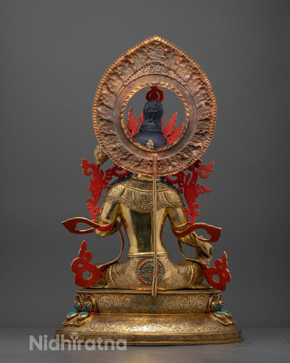 Back view of Green Tara statue highlighting carved halo and fire-gilded surface