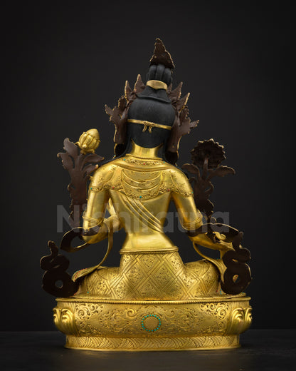 Back view of Green Tara statue showing detailed carvings, gold layers, and polished finish on copper