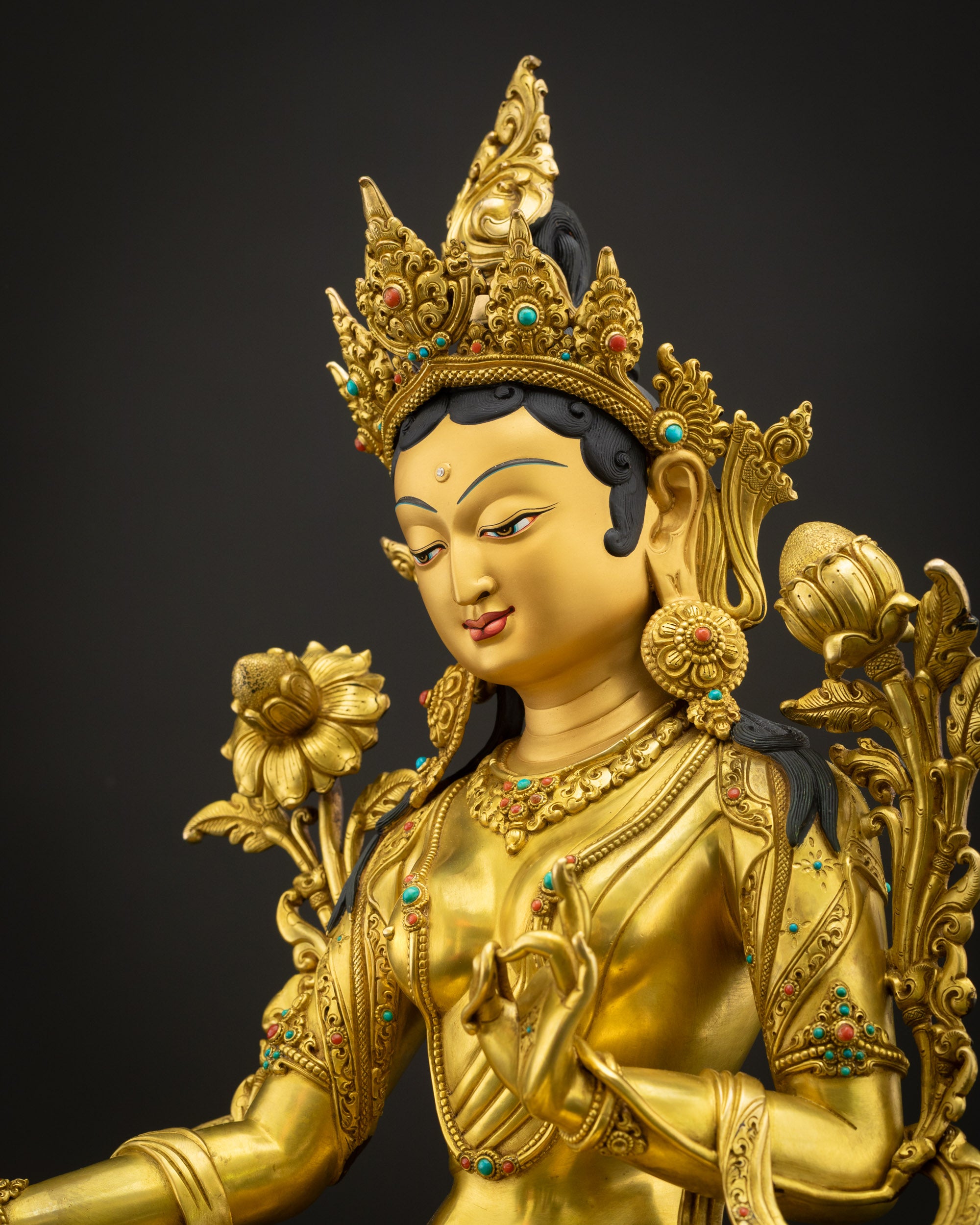Side view close-up of Green Tara statue highlighting 3D carvings, polished lotus pedestal, and craftsmanship