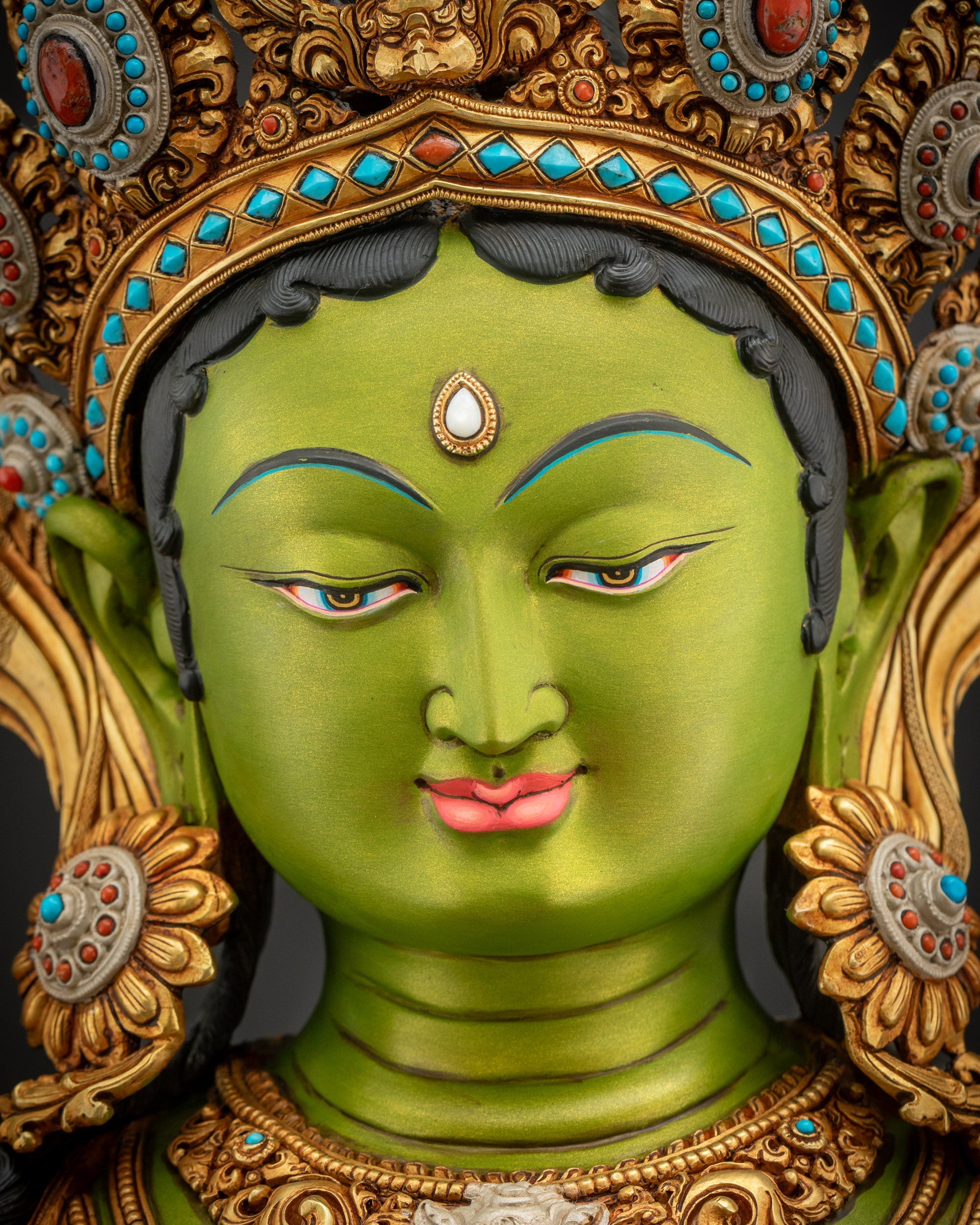 Green Tara Statue detailed face view with serene expression, long lashes, and gold fire-gilded diadem