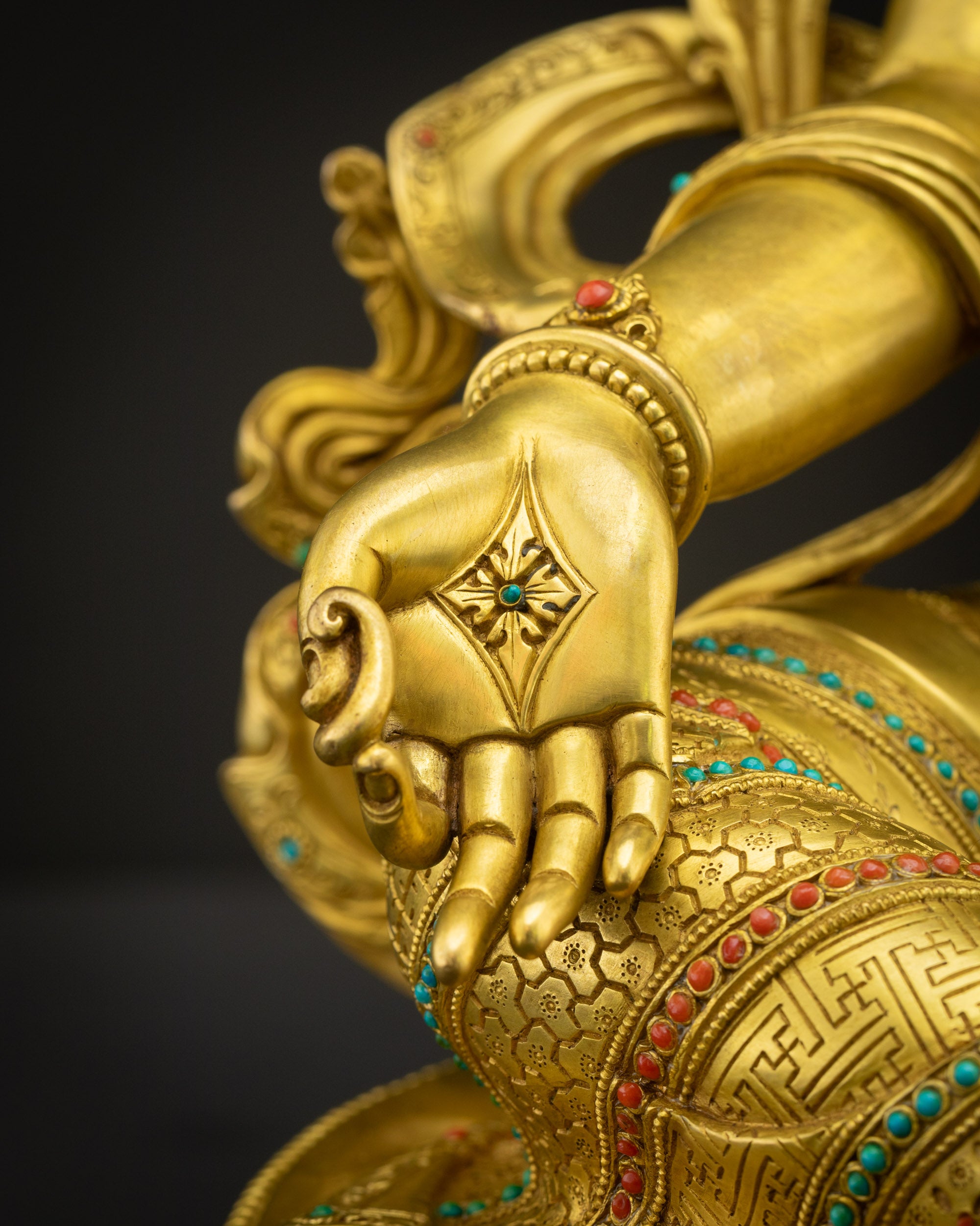 Green Tara Statue holding utpala lotus with Varada Mudra, offering protection