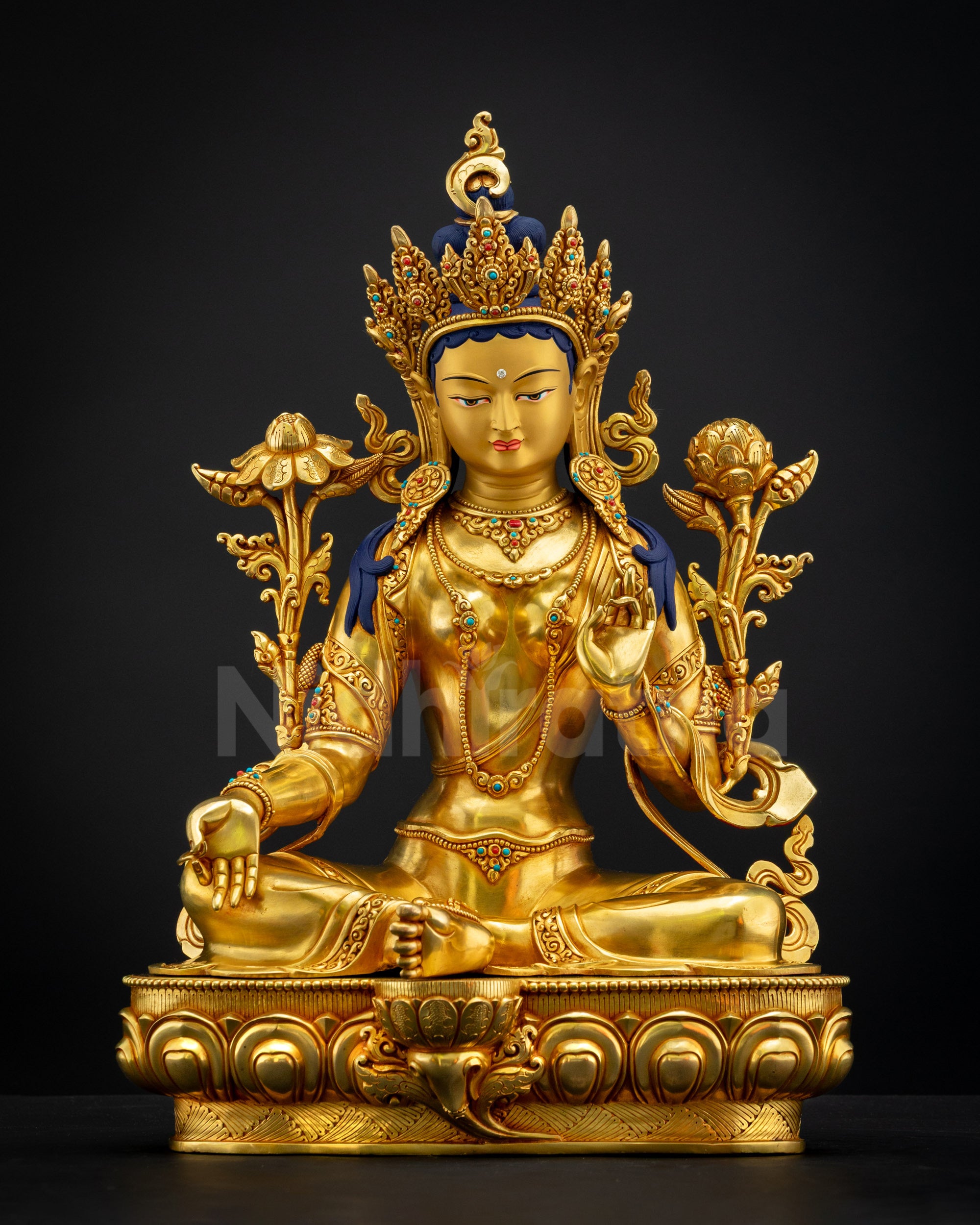 Green Tara Statue seated in Lalitasana on lotus throne holding utpala flowers, handcrafted Nepalese gilded copper artwork