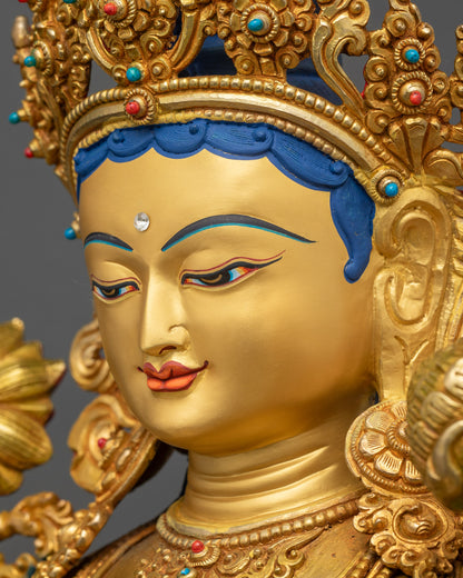 Green Tara Statue side close up serene gold-gilded face and jewelry