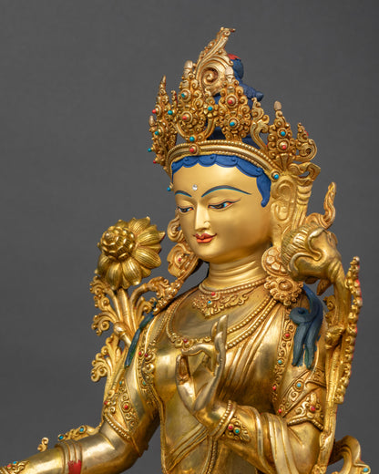 Green Tara Statue side view ornate jewelry and swirling robes Nepalese art