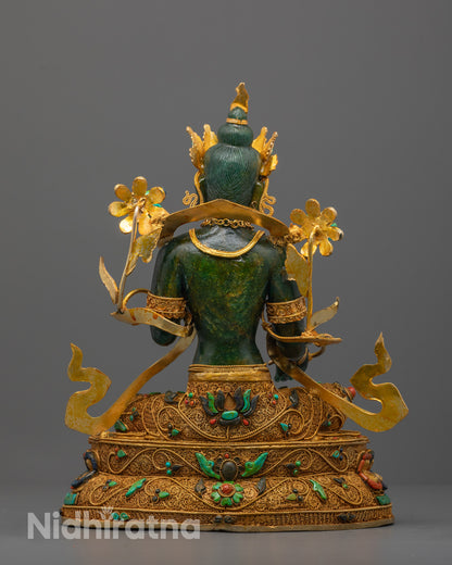 Green Tara and the craftsmanship of her lotus throne with symbolic gold filigree.