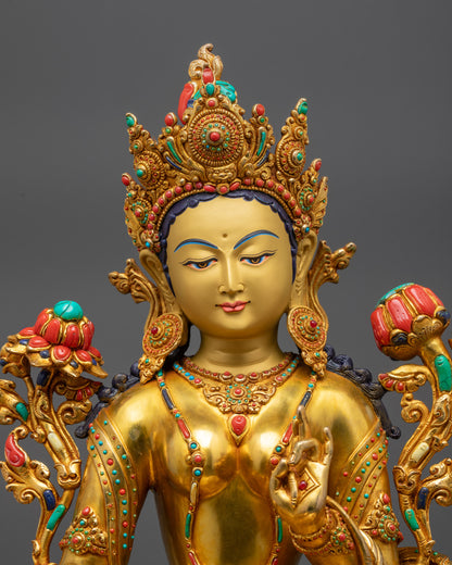 Green Tara gold gilded face with jeweled crown, utpala flower and semi-precious stones
