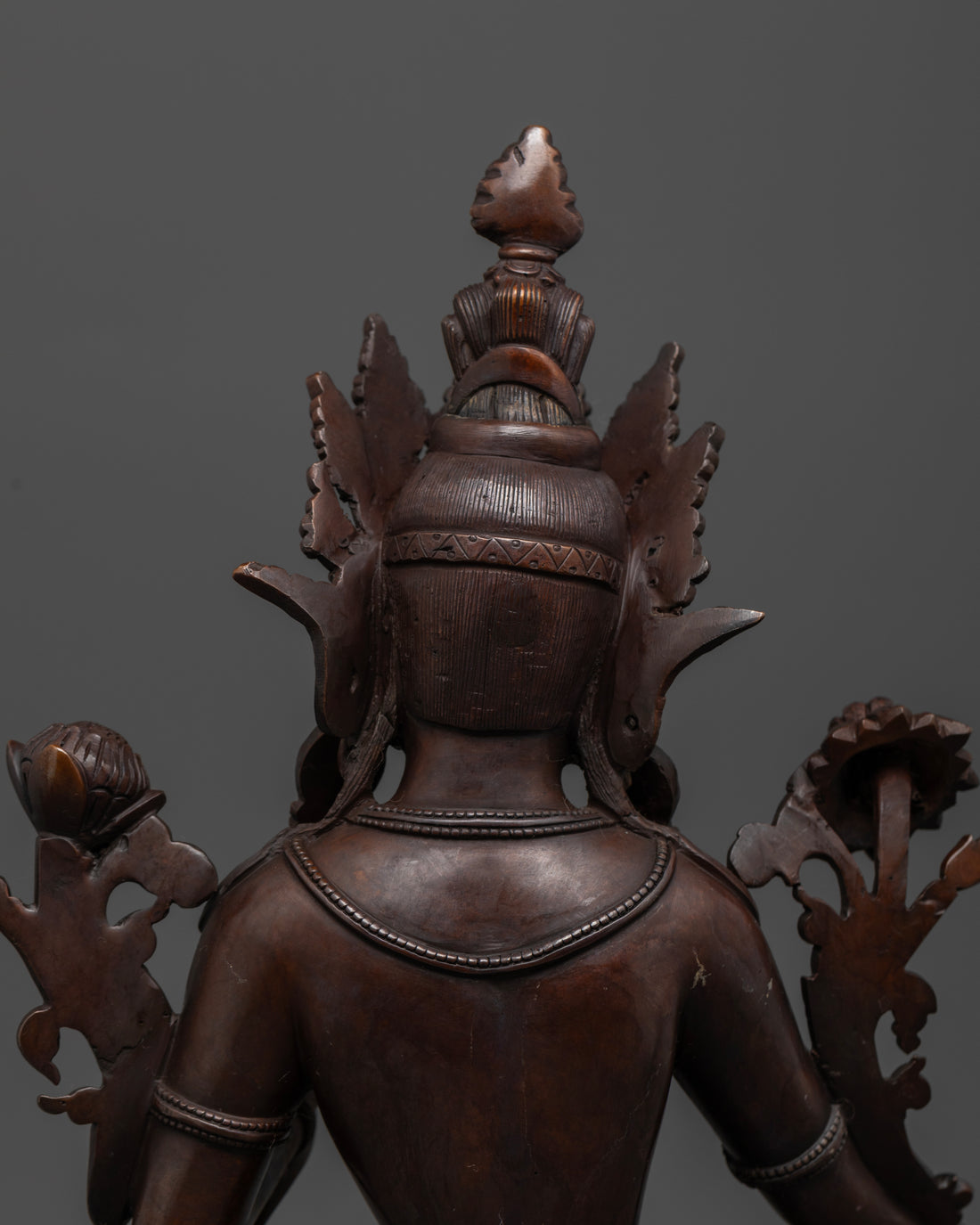 hair and crown of green tara statue made of oxidized copper