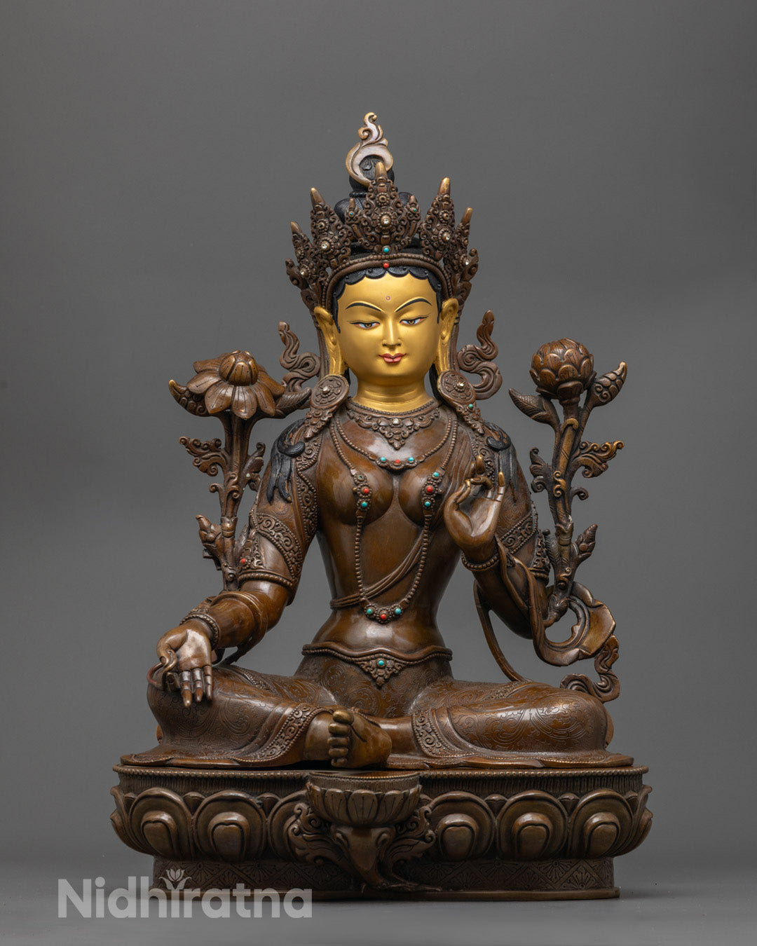 Green Tara oxidized copper statue with 24k gold face and utpala flower