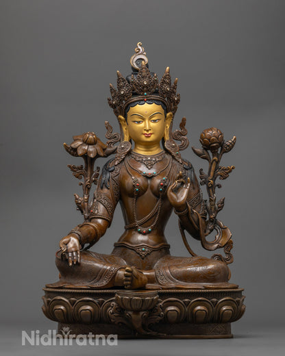 Green Tara oxidized copper statue with 24k gold face and utpala flower