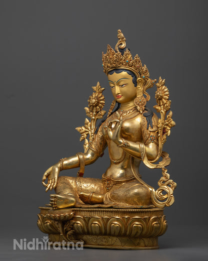 Green Tara's gold-plated copper body and intricately detailed crown with gemstone inlays