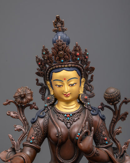 Green Tara’s intricate Samkhachilaka robe, jeweled crown, and semi-precious stone inlays, showcasing detailed lost wax craftsmanship.