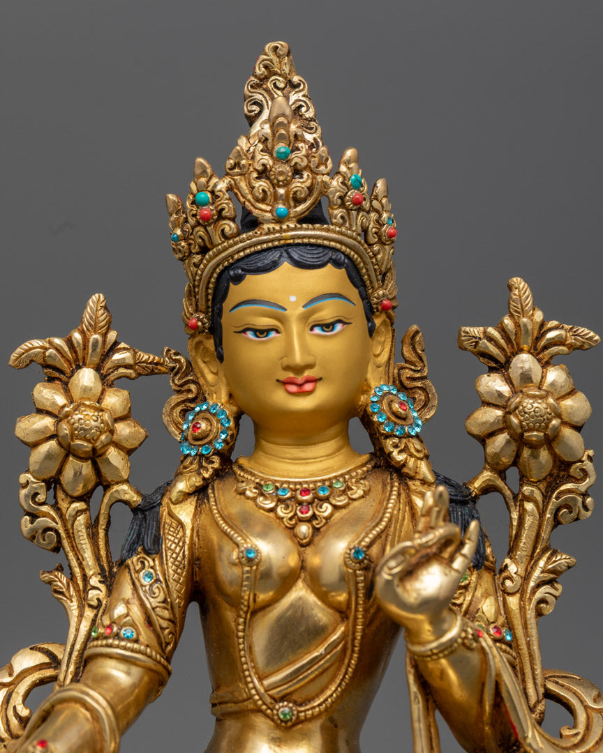 Green Tara’s serene expression and utpala flower, showcasing intricate craftsmanship and divine detail