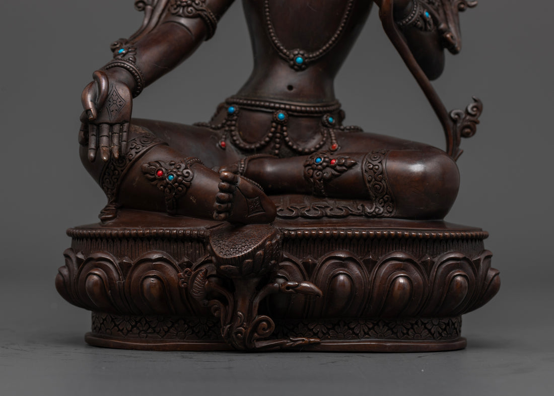 Green Tara statue with Green Tara sitting on a moon disc upon a lotus seat with step forward stance