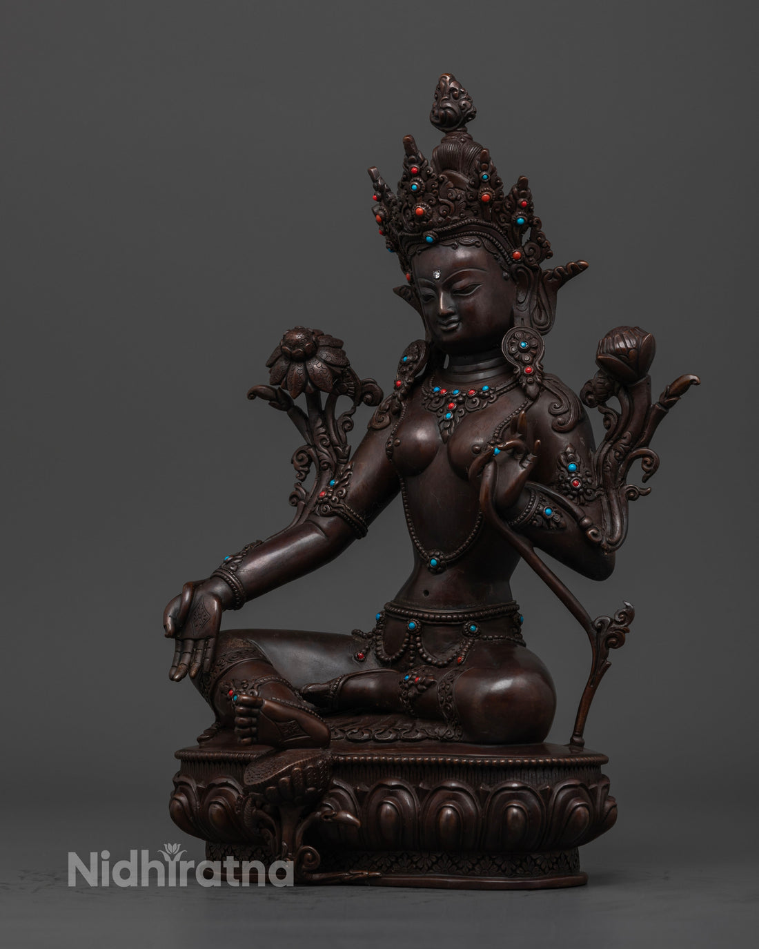 side profile of Green Tara statue