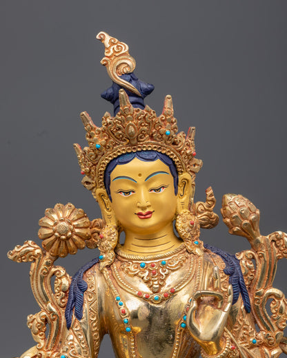 Green Tara statue adorned with semi-precious stones and painted with rich acrylic colors