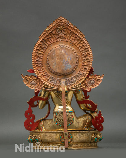 Green Tara statue back view, engraved lotus base and sacred Himalayan design