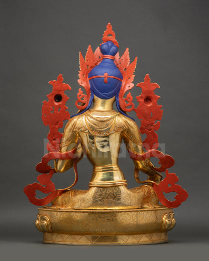 Green Tara statue back view revealing detailed carving and smooth polished copper