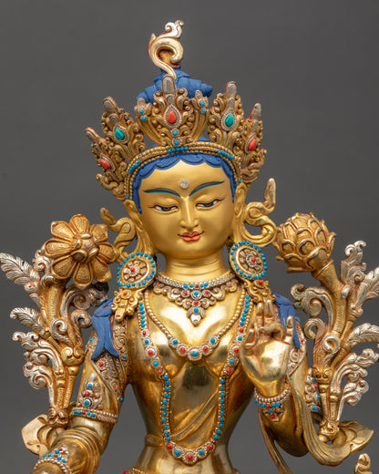 Green Tara statue close up handcrafted Nepalese copper sculpture with gold detailing