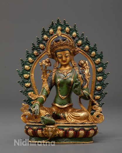 Green Tara statue from Nepal with gold-plated face green electroplated body and lotus throne in royal ease pose