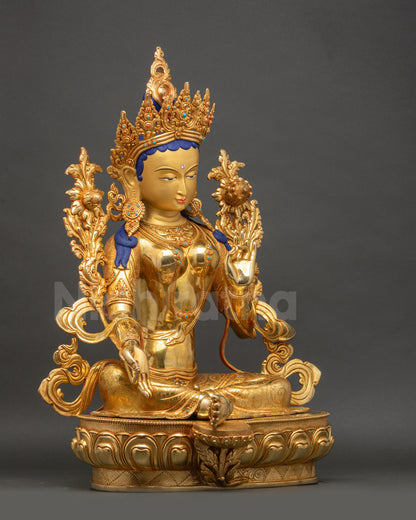 Green Tara statue right side view holding utpala lotus with carved details