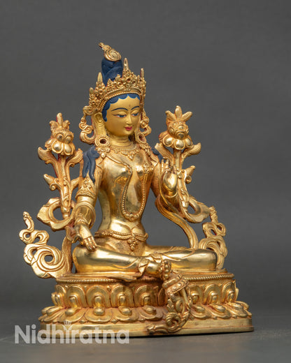 Green Tara statue right side view, seated on lotus throne in royal ease mudra
