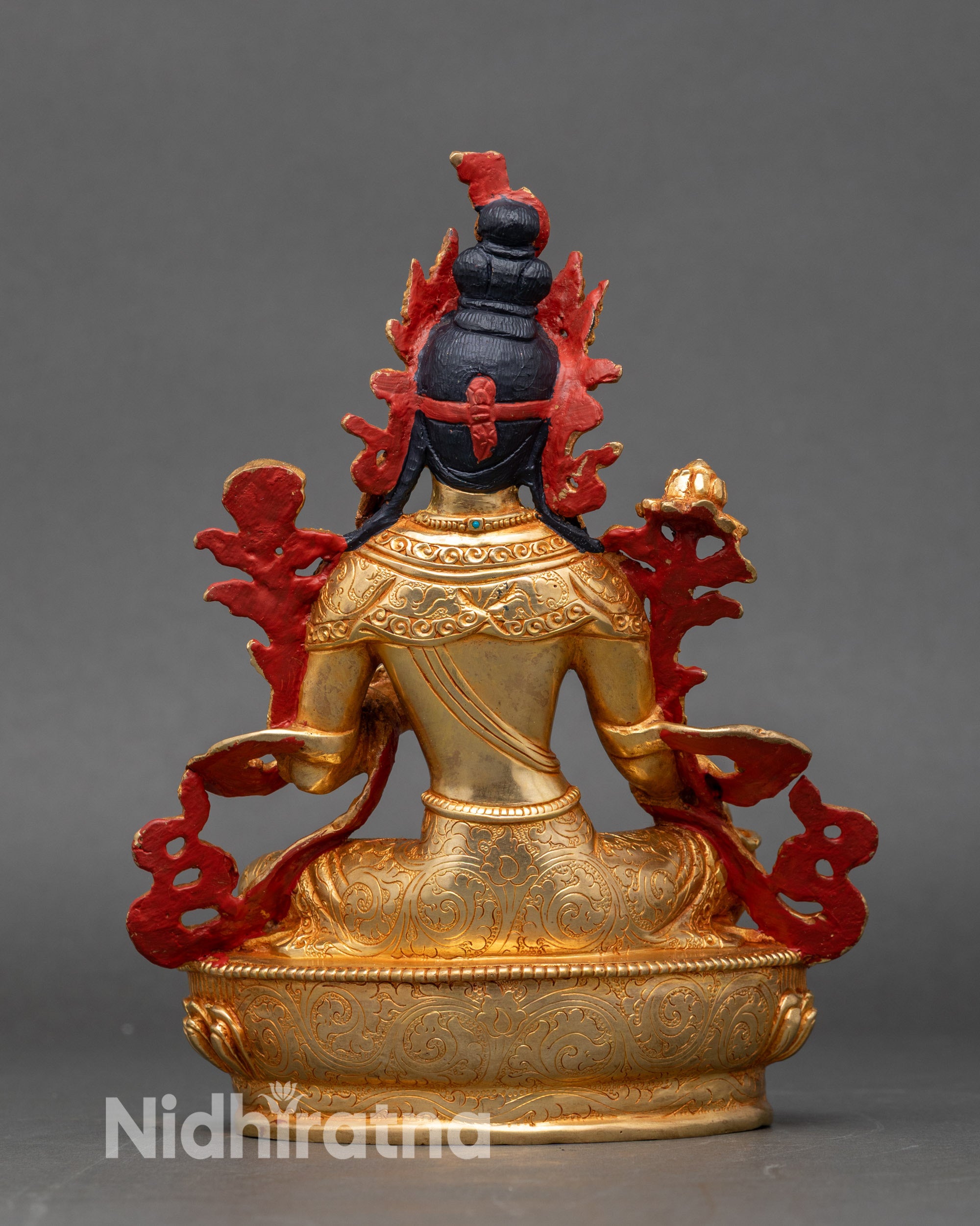 Green Tara statue showing semi-precious stone embellishments and intricate craftsmanship