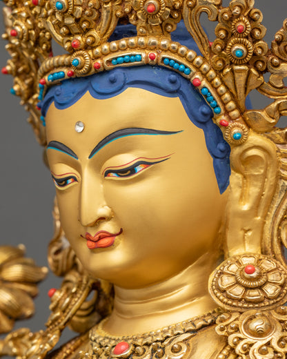 Green Tara statue side face close up gold fire-gilded Himalayan artwork
