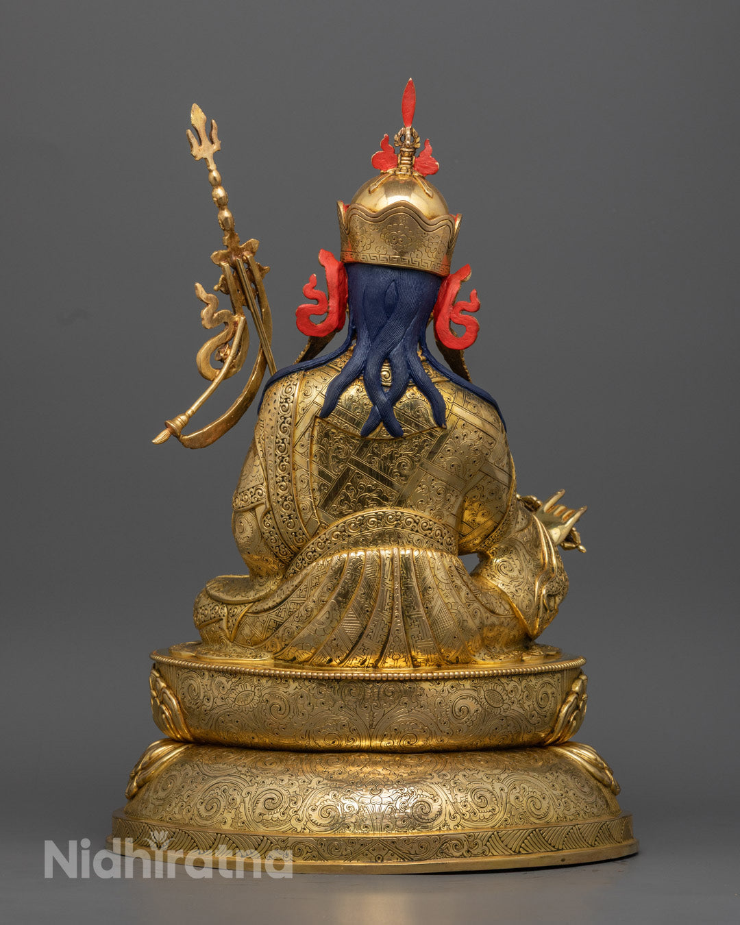 Guru Rinpoche Padmasambhava statue | Tibetan Buddhist figure | lotus-born master, Vajrayana guru, tantric meditation teacher, holding vajra and kapala, seated on lotus throne, rich traditional attire, Himalayan Buddhist icon.